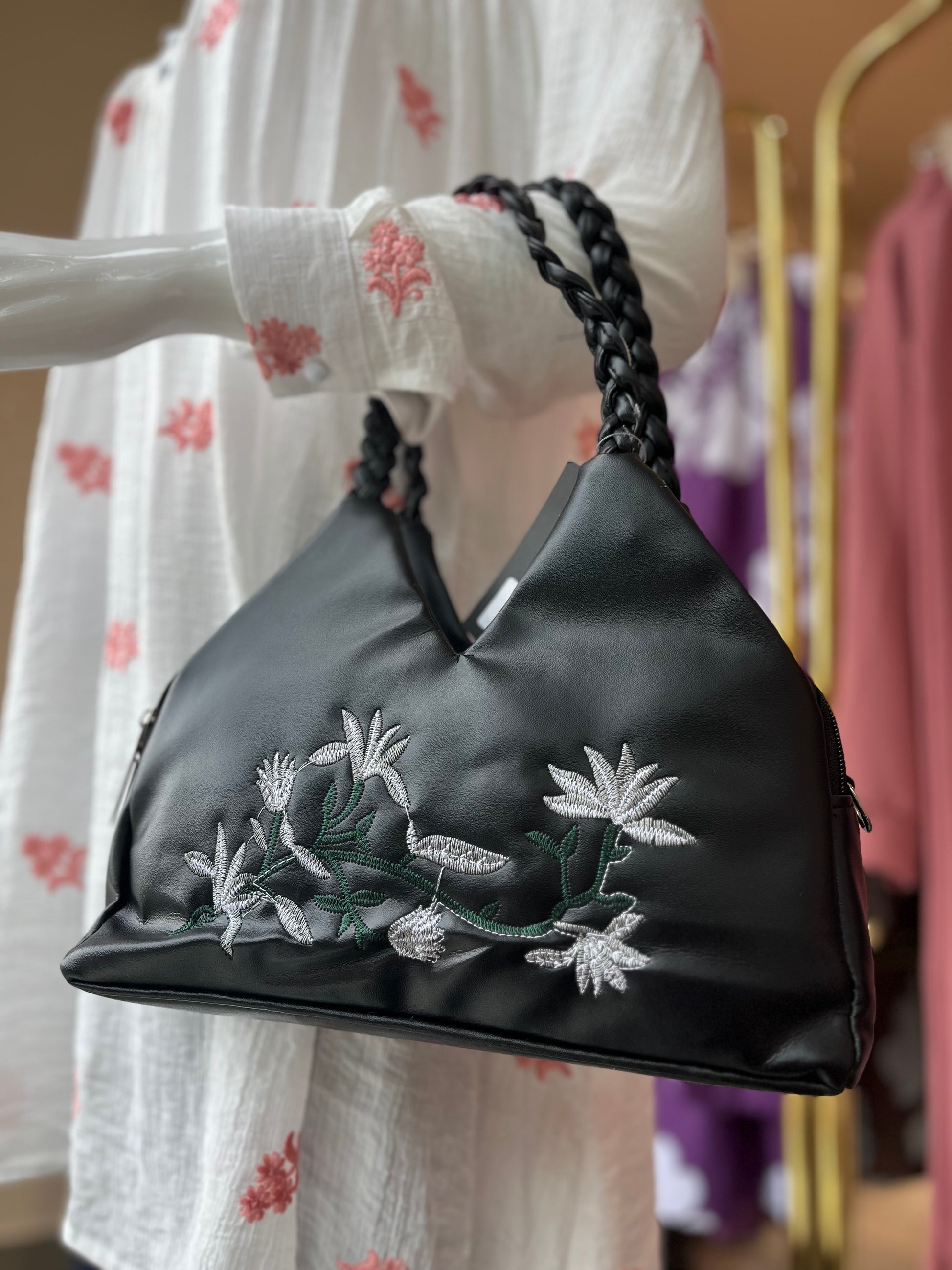 Handbag with braided handle