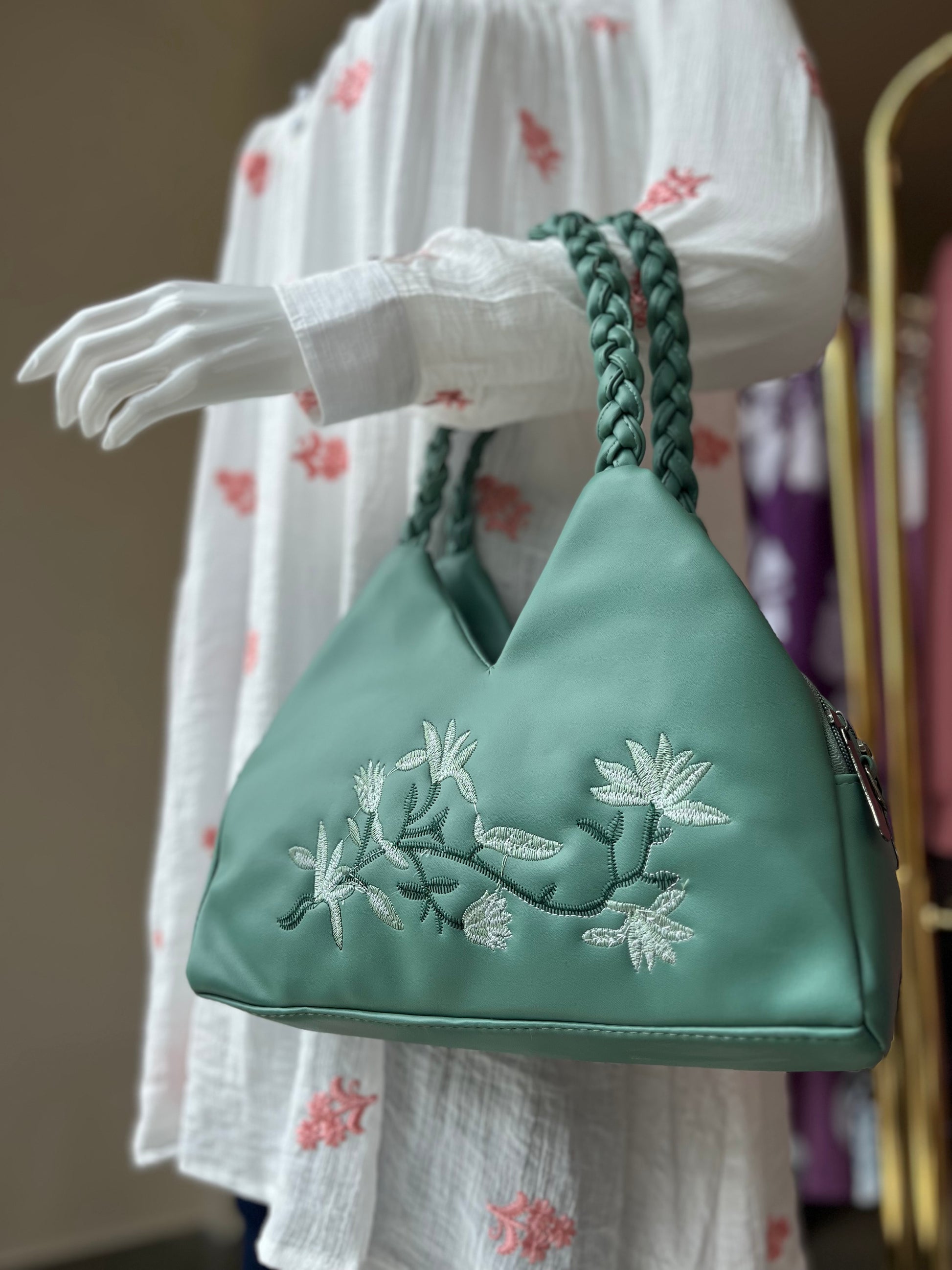 Handbag with braided handle